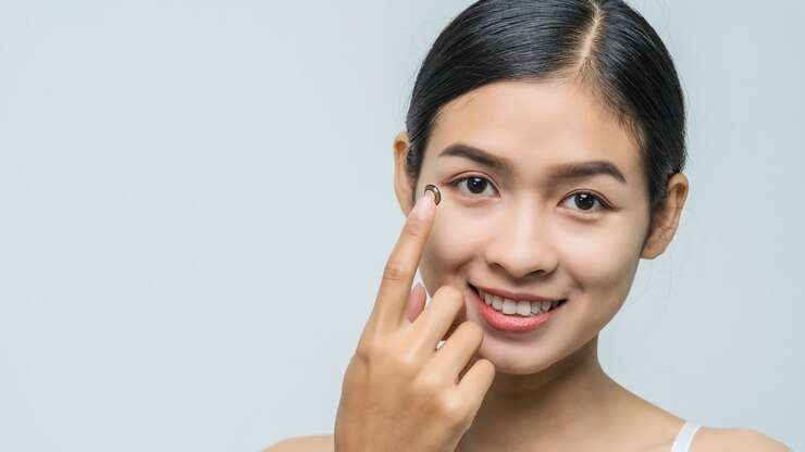 close-up-young-asian-woman-wearing-contact-lens