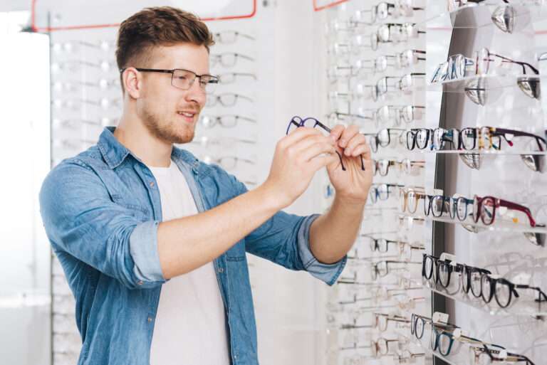 man-looking-new-glasses-optometrist