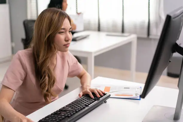 Tired Indian girl taking off glasses, massing nose bridge isolated on grey studio background, exhausted young woman feeling eye strain, unhappy stressed student, teacher feeling unwell